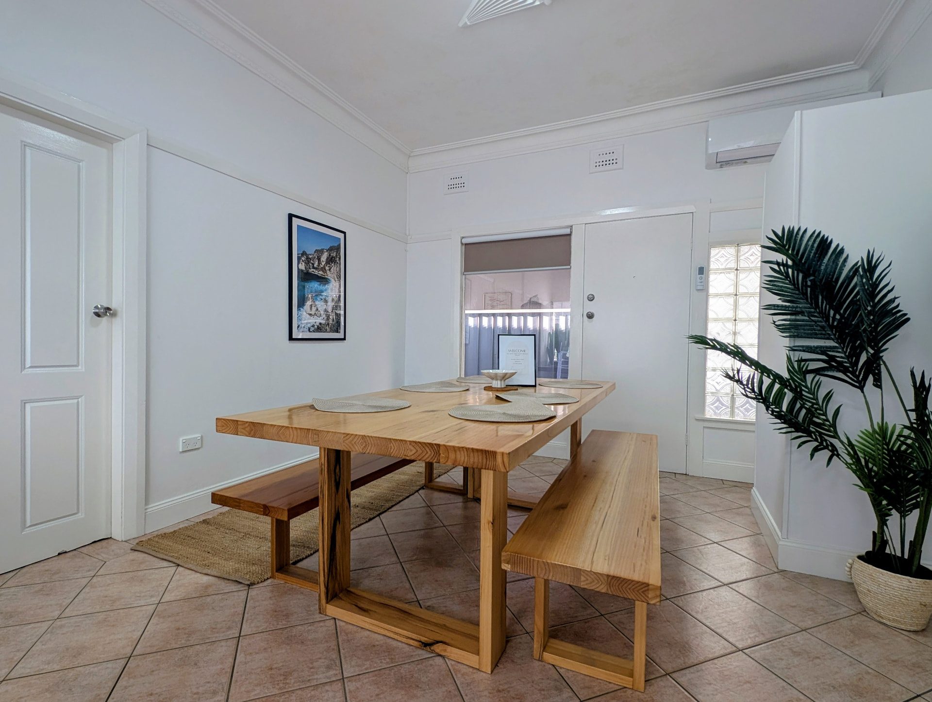 Dining room with a large timber table and benches